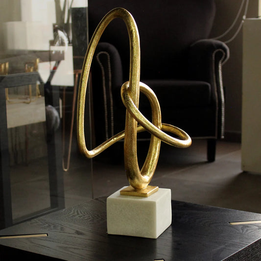 Escultura dorada con mármol YAO